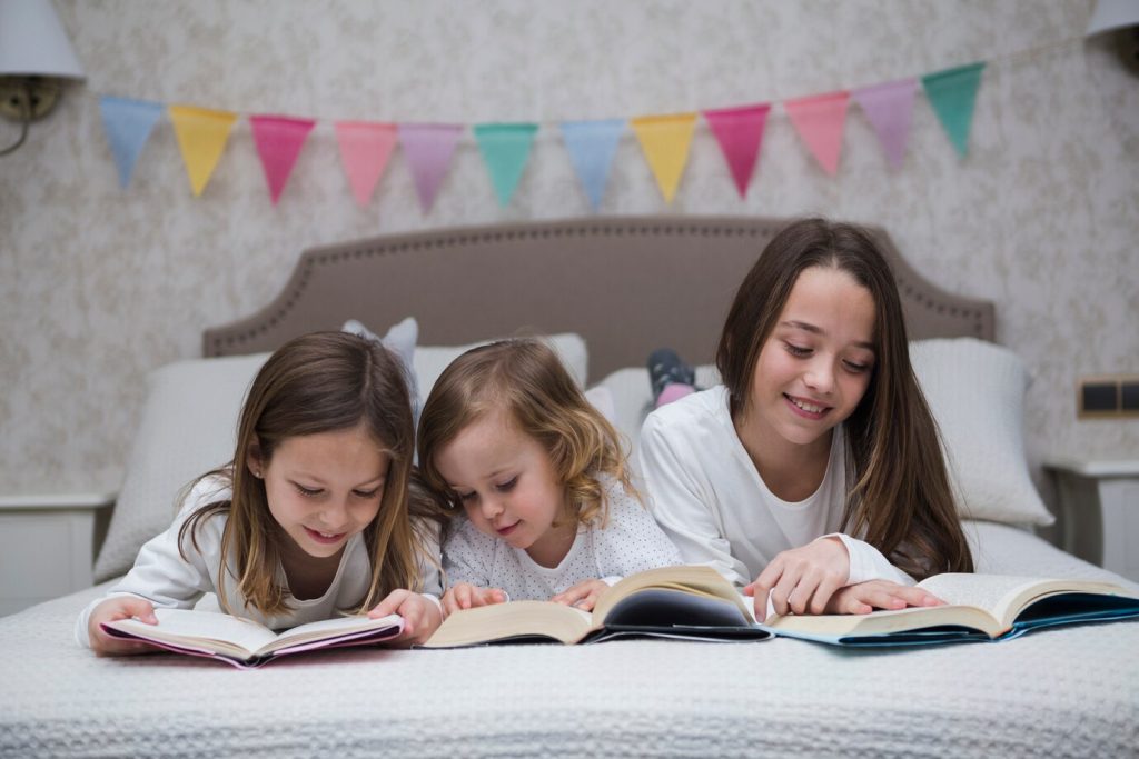 sisters-reading-book-together_23-2148104270